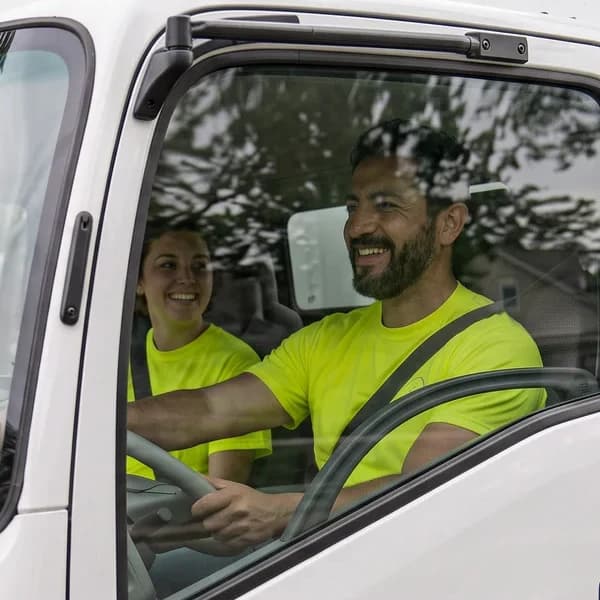 Two HaulShare hauling partners driving their box truck to the next job